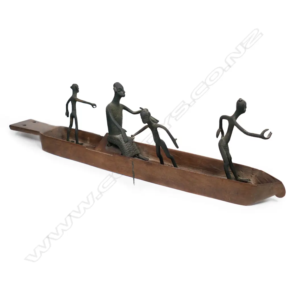 A vintage African(?) tribal carved wooden boat with four bronze figures – one with a fish, Image 1++